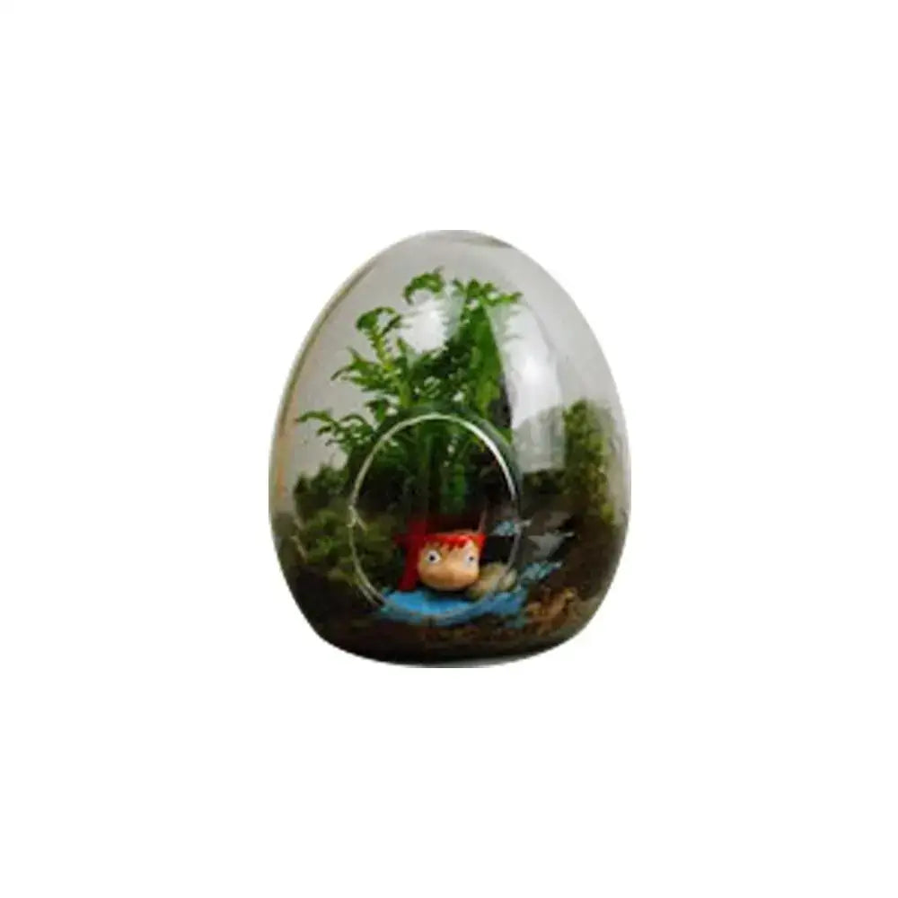 DecorBites™ high quality glass egg-shaped terrarium with transparent design housing green plants and red accessory figure
