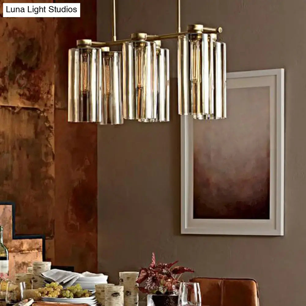 Modern brass and glass suspension pendant light fixture with cylindrical shades for island ceiling and dining room use