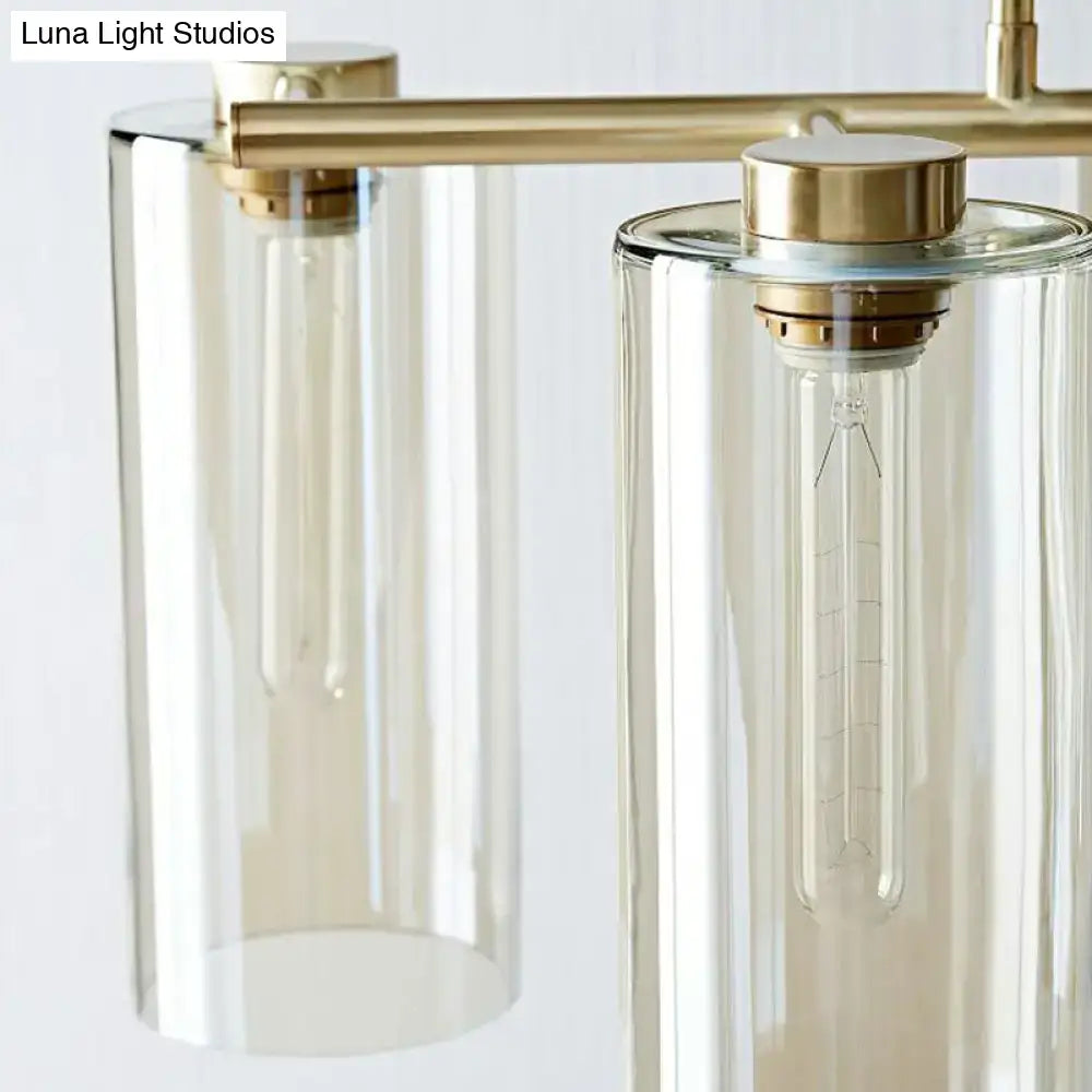 Modern brass-finished DecorBites™ suspension pendant light with clear glass shades for island ceiling and dining room