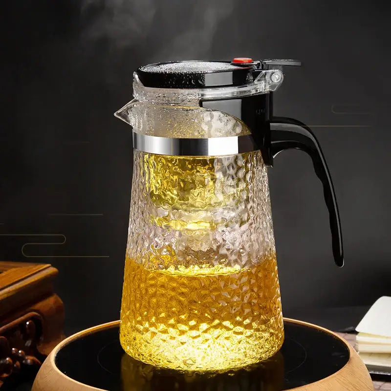 Clear textured glass tea maker with black lid silver rim and handle featuring hammer pattern filter by decorbites glass tea