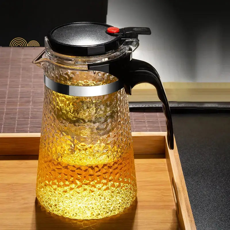 Clear textured glass tea maker with black lid handle and silver band from decorbites glass tea maker collection