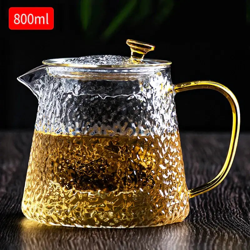 Decorbites™ glass tea pot set featuring an 800ml clear hammered glass tea pot with gold-toned handle and lid knob