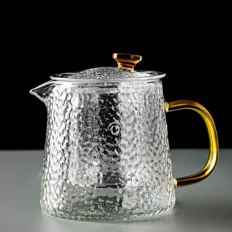 Decorbites glass tea pot set featuring a clear hammered glass tea pot with gold-toned handle and lid knob for kung fu tea brewing