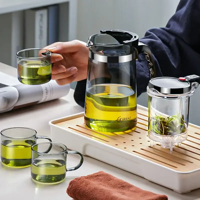 Clear glass tea pot with black lid silver rim branded gianxi from DecorBites glass tea set with infuser
