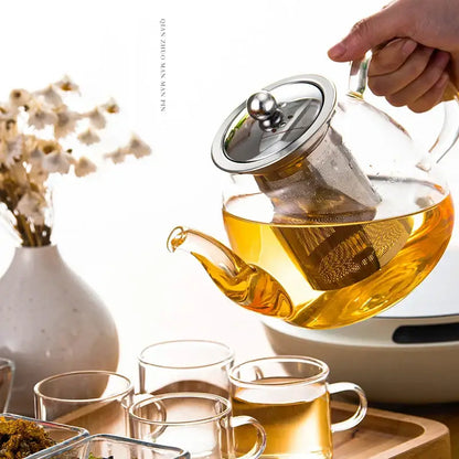 Decorbites™ glass tea pot with stainless steel lid and built-in filter filled with golden tea for steeping puer and coffee