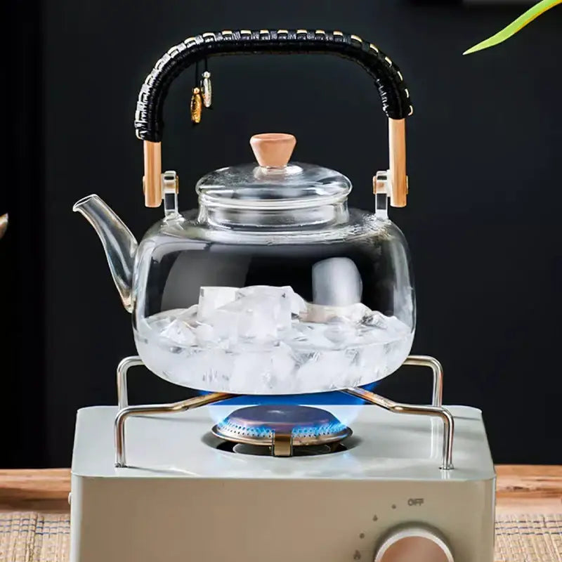 DecorBites glass tea pot with transparent heat-resistant glass, black weave handle, wooden accents, and bamboo lid knob