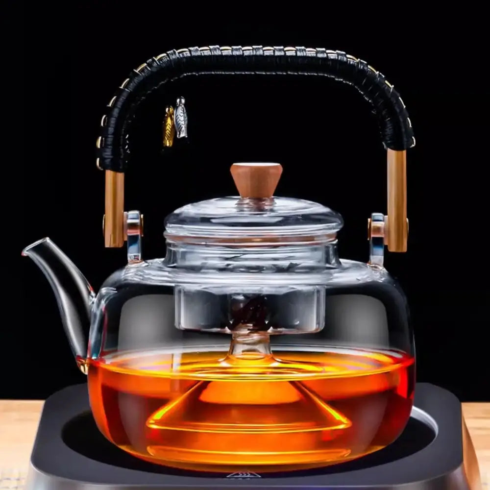 Clear glass tea pot with black woven wooden handle silver infuser and wooden accents by decorbites glass tea