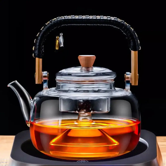 Clear glass tea pot with black woven wooden handle silver infuser and wooden accents by decorbites glass tea