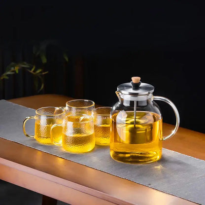 Clear glass tea set with stainless steel lid and wooden knob featuring three matching textured mugs decorbites glass tea