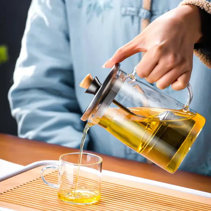 Clear glass tea set by decorbites glass tea with stainless steel lid wooden handle pouring golden tea
