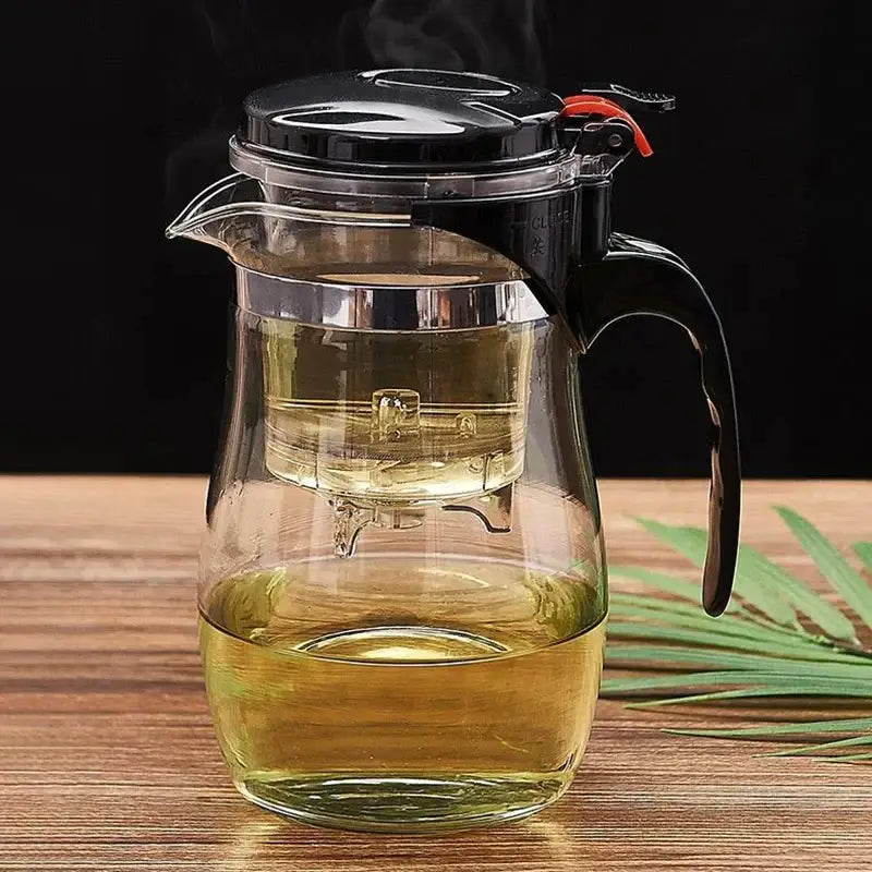 Clear glass tea pitcher with black lid and built-in filter for steeping leaves from decorbites glass tea set