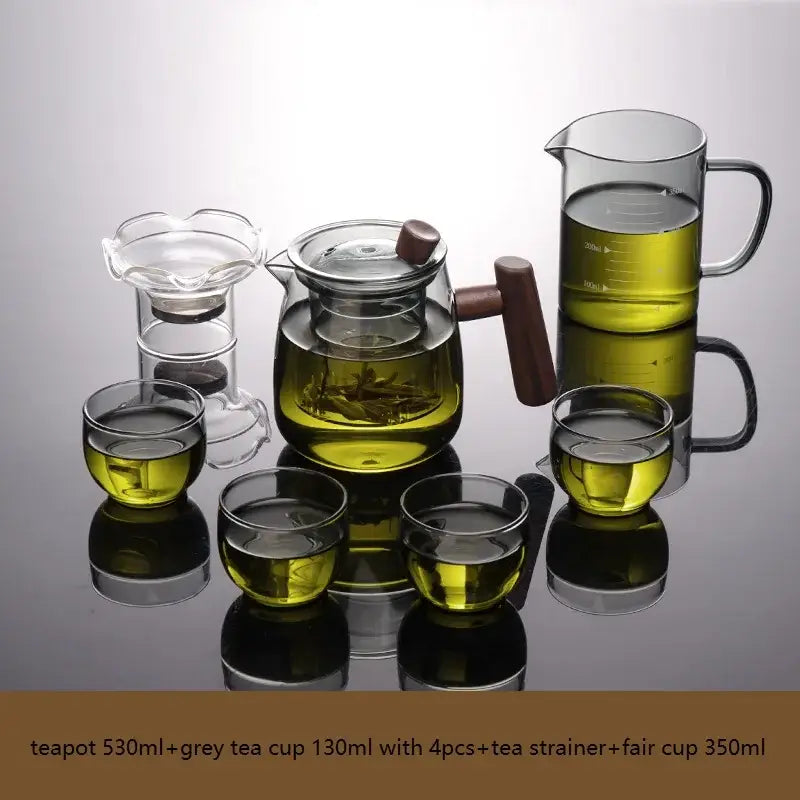 Clear glass tea set from decorbites with solid wood handles and tea water separation technology filled with green tea