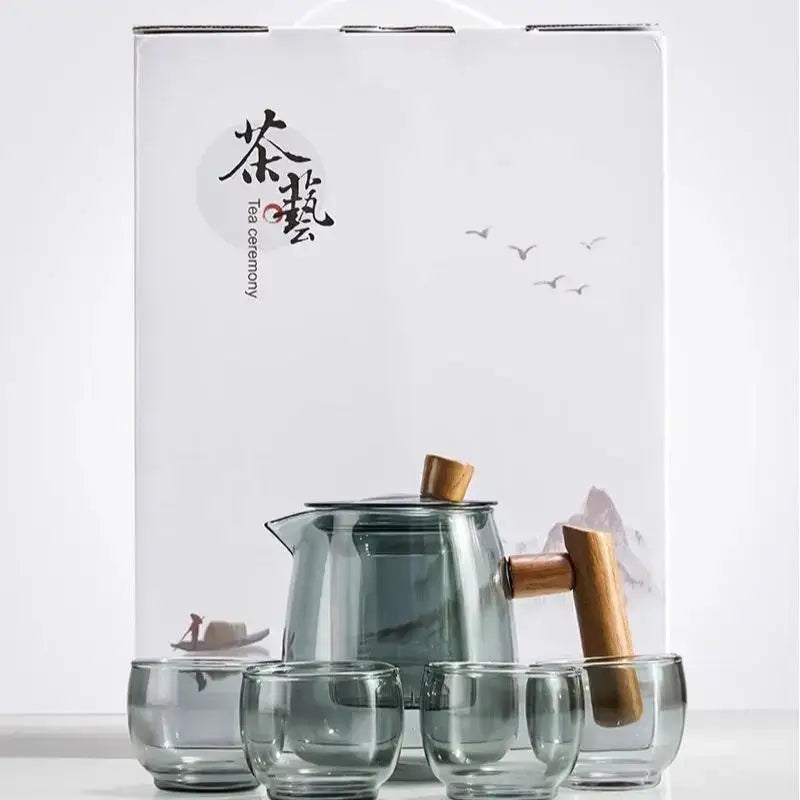 Decorbites™ glass tea set with clear glass teapot and cups featuring solid wood handle and tea water separation technology