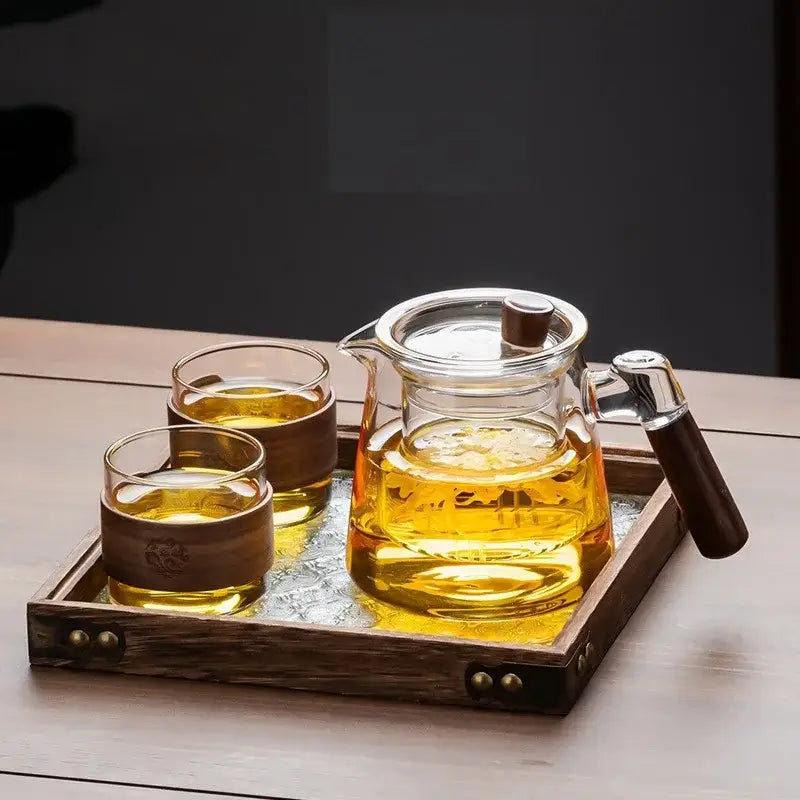 DecorBites glass tea set with clear glass teapot wooden handle and lid knob on retro glass tray with two glasses
