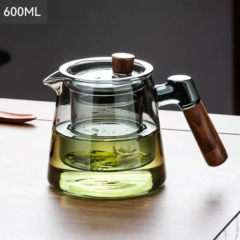 Decorbites glass tea set featuring a clear glass teapot with wooden handle and inner strainer on retro glass tray