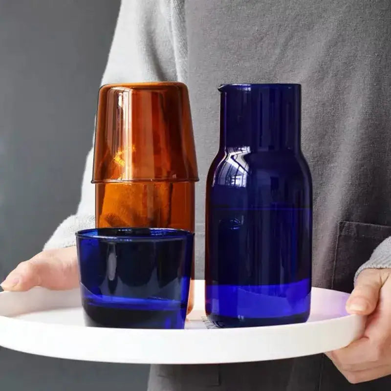 Set of three hand-blown glass teacup set pieces in cobalt blue and amber with heat-resistant pitcher and tumbler