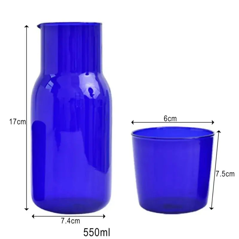 Vibrant cobalt blue glass teacup set and pitcher combo with smooth glossy surfaces and heat-resistant design