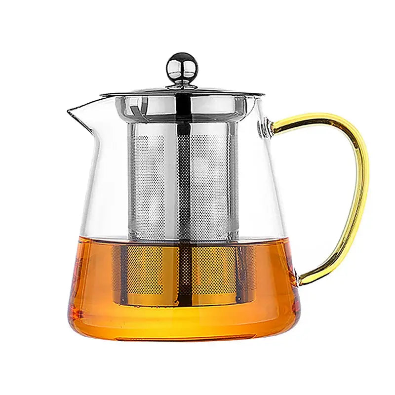 Clear glass teapot with gold-toned handle and stainless steel infuser filled with amber tea by decorbites glass teapot