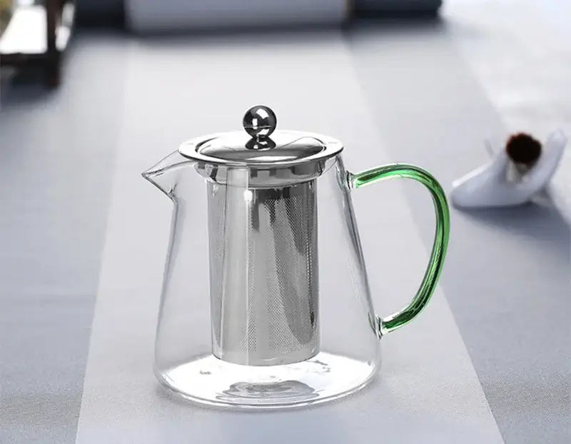 Clear glass teapot with green handle stainless steel lid and built-in strainer by DecorBites glass teapot 550ml