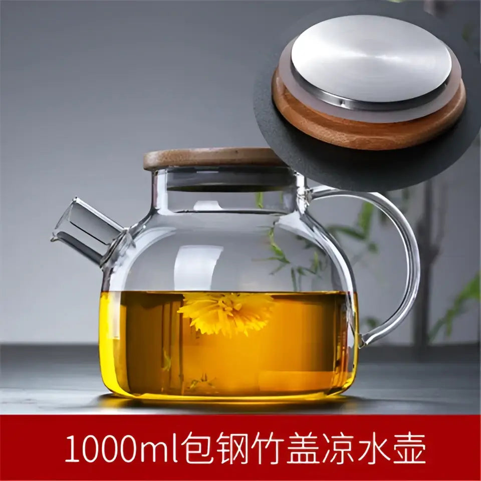 A decorbites glass teapot cold water jug with wooden lid stainless steel seal filled with golden tea and floating flowers