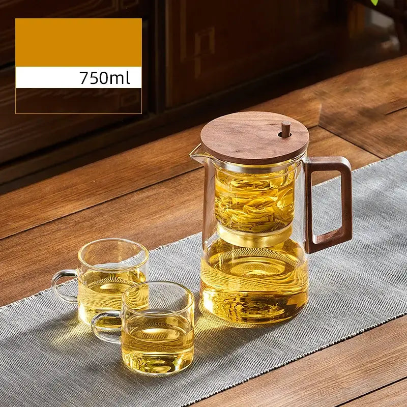 Decorbites glass teapot 750ml infuser pitcher with wooden lid and handle filled with golden tea leaves for brewing