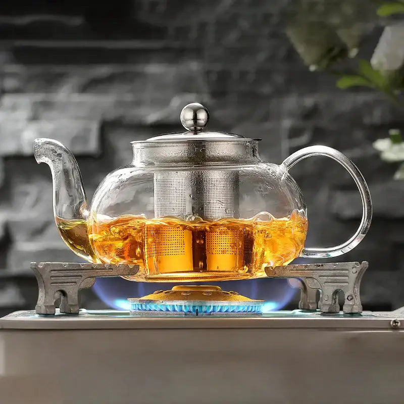 Clear glass teapot flower with stainless steel lid handle and mesh infuser in decorbites glass teapot tea set