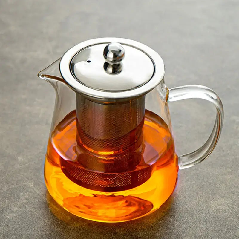 Decorbites glass teapot with stainless steel lid and built-in filter holding orange tea for puer tea and coffee use