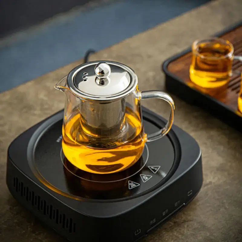 Clear glass decorbites glass teapot with stainless steel lid and handle filled with golden puer tea for coffee use