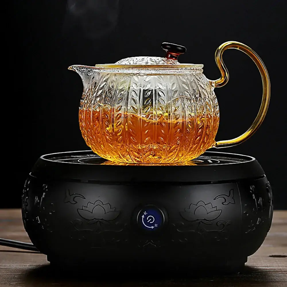 Decorbites glass teapot with gold-toned handle and lid knob featuring intricate leaf-patterned etching perfect for tea brewing