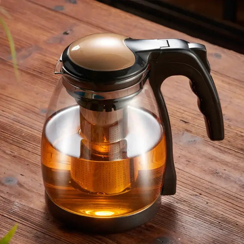 Clear glass DecorBites glass teapot with black handle gold-toned lid and stainless steel infuser for Kung Fu tea brewing