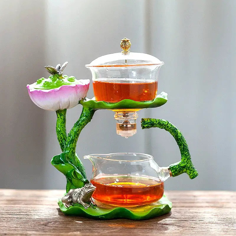Decorbites glass teapot with lazy tea infuser featuring lotus motif pink white petals and gold-toned accents