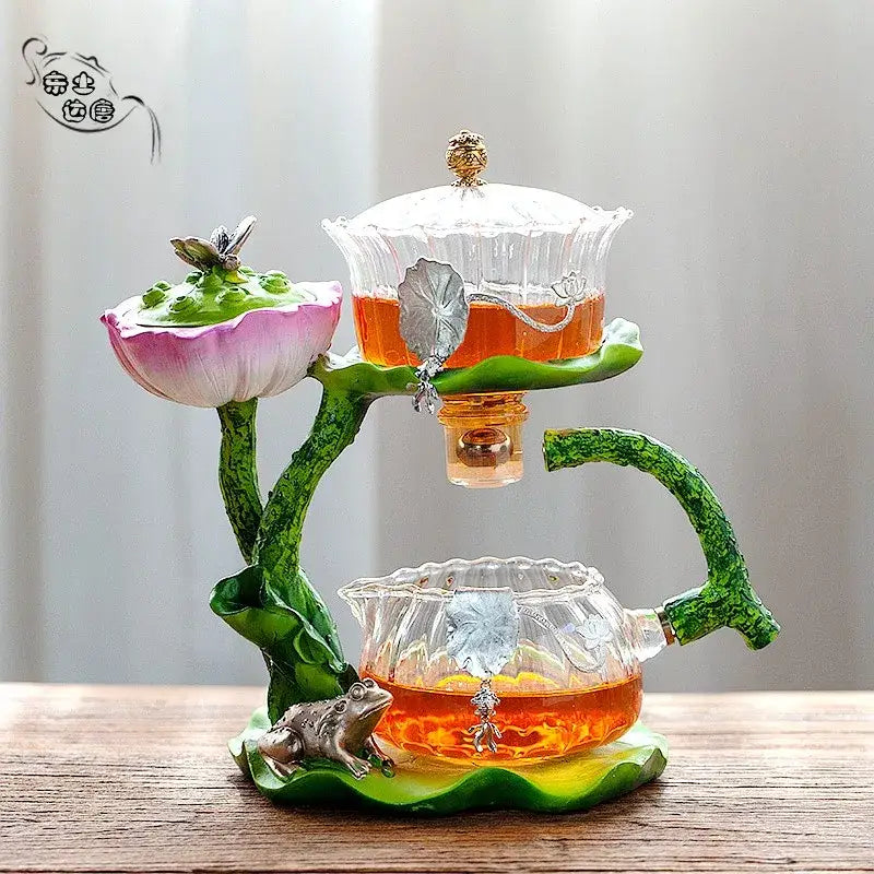 Decorbites glass teapot and lazy tea infuser featuring two-tiered clear glass with gold lids and silver leaf accents