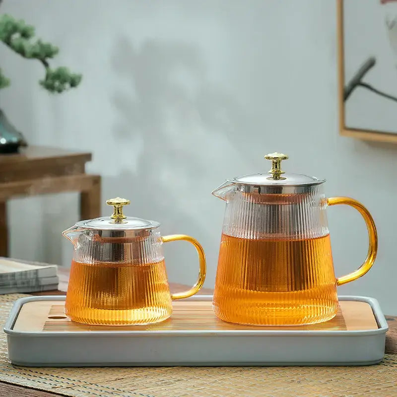 Set of two decorbites glass teapot puer kettles with clear ribbed glass, gold handles, and stainless steel infusers for tea making