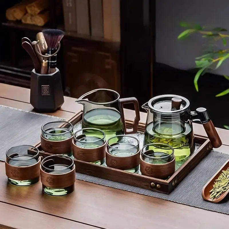 Elegant decorbites glass teapot set with wooden handle and lid paired with matching glasses featuring wood-rimmed bases