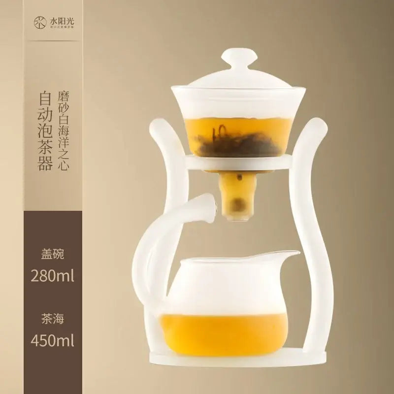 White ceramic glass teapot with frosted lid and handle featuring an automatic magnetic drip pot for brewing by DecorBites