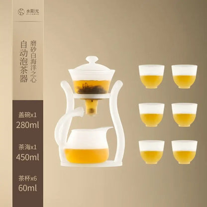White ceramic automatic tea set with magnetic drip pot and glass teapot featuring 280ml lid bowl and six 60ml cups filled with tea