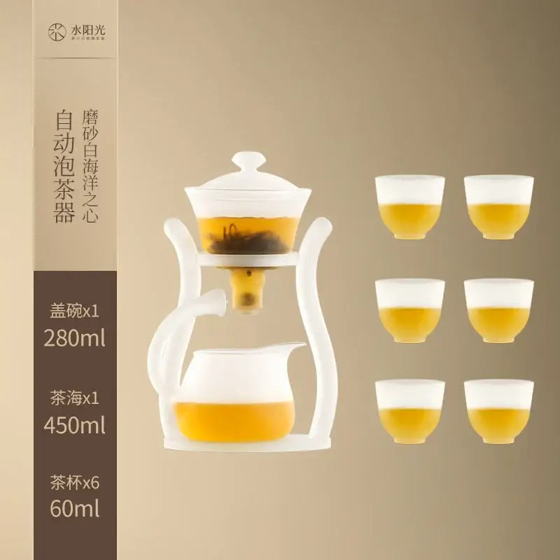 White ceramic automatic tea set with magnetic drip pot and glass teapot featuring 280ml lid bowl and six 60ml cups filled with tea