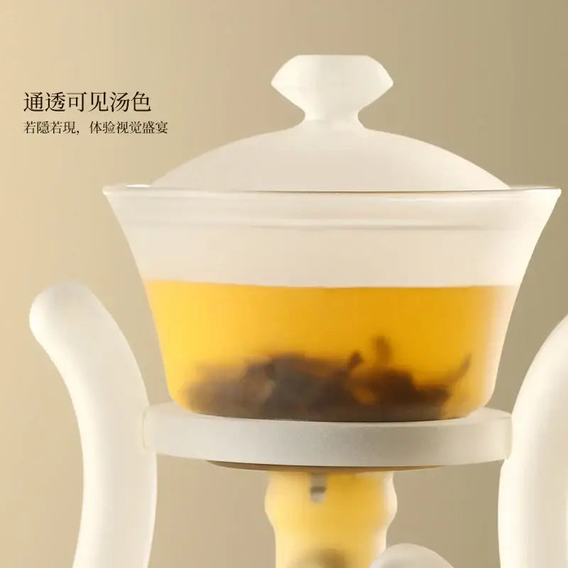 Decorbites glass teapot with magnetic drip pot and base in white translucent glass featuring curved handles and central stem