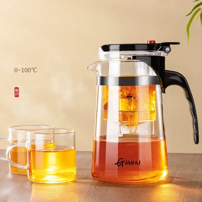 Clear glass decorbites glass teapot with black handle and lid featuring built-in infuser and one-button filter separation