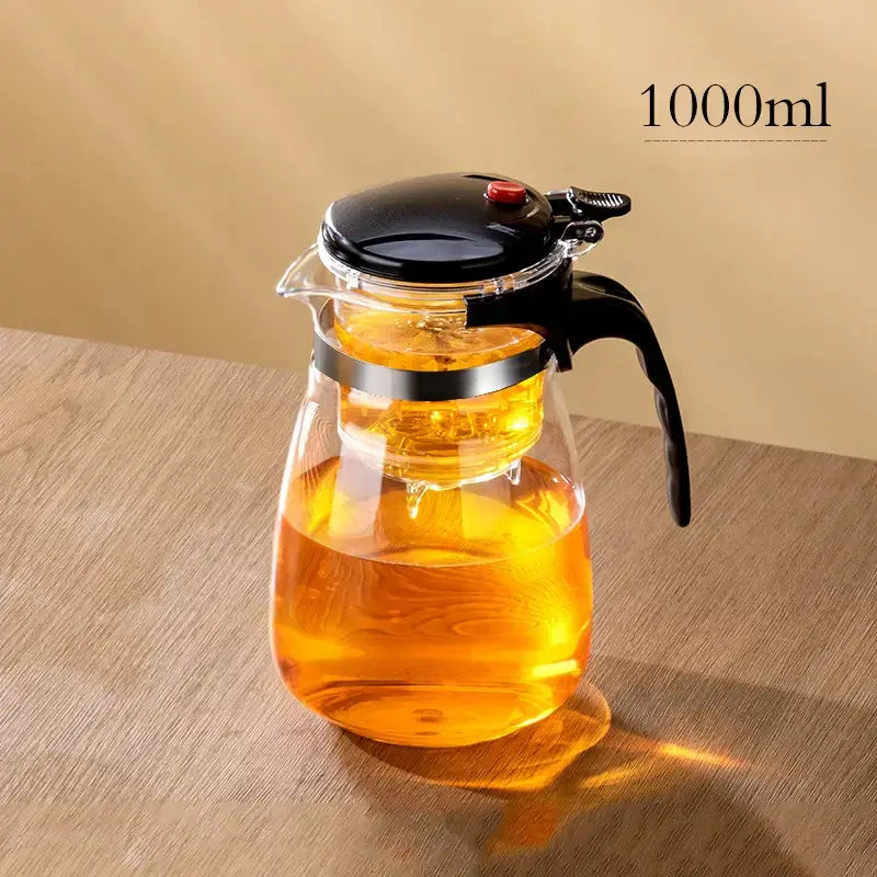 Clear glass decorbites glass teapot with black lid handle and integrated metal ring for stability and filter separation