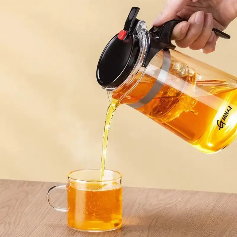 Clear glass decorbites glass teapot with black lid handle and red button for one-button tea brewing filtration