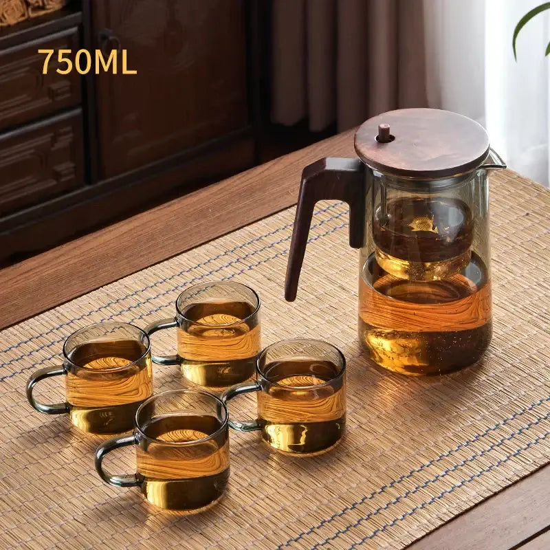Decorbites glass teapot 750ml with wooden lid and handle featuring amber glass mugs filled with golden tea