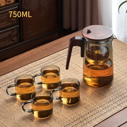 Decorbites glass teapot 750ml with wooden lid and handle featuring amber glass mugs filled with golden tea