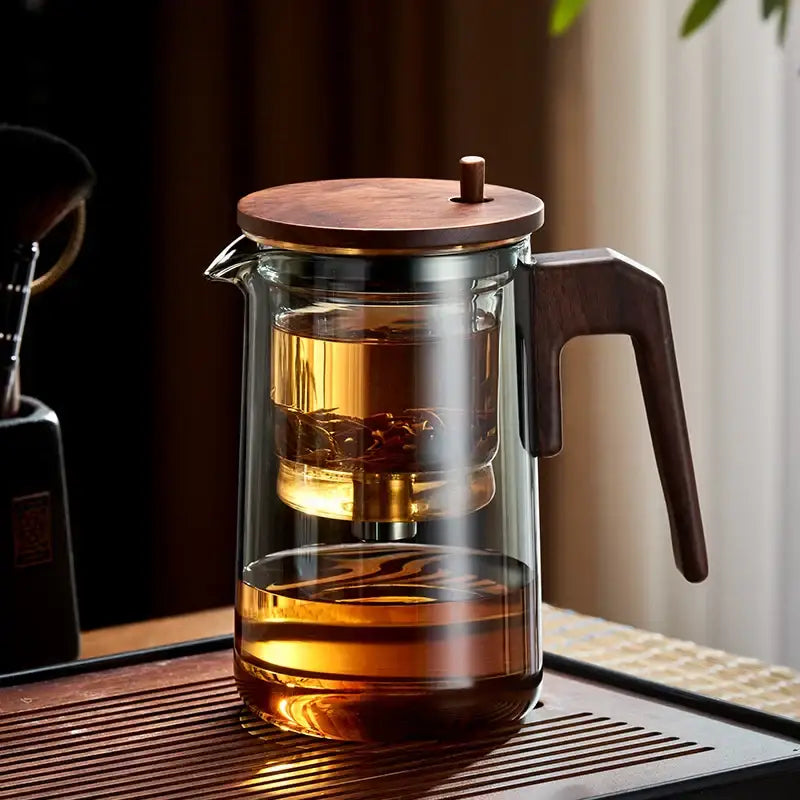 Decorbites glass teapot with dark wood handle and lid features internal infuser for heat resistant tea steeping