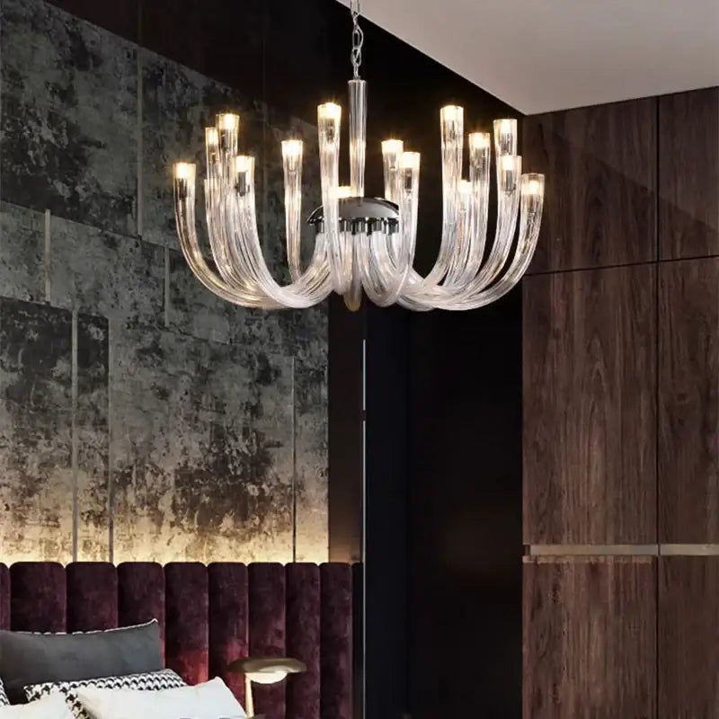 DecorBites glass tube dining chandelier with clear glass curved arms and warm glowing lights for modern dining spaces