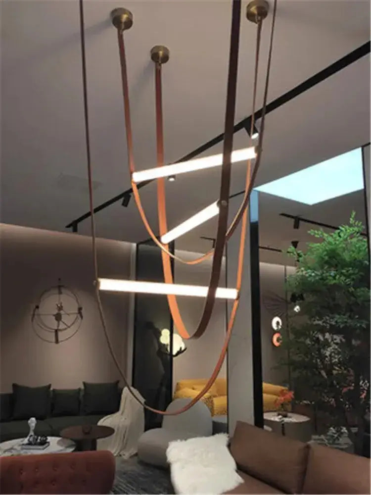 DecorBites glass tube pendant lamp with horizontal LED bars, brown leather straps, and brass fittings for modern interiors