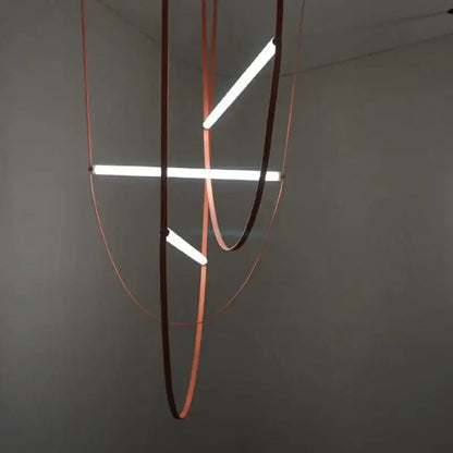 Modern minimalist decorbites glass tube pendant light with three glowing white led tubes in copper-toned circular frame
