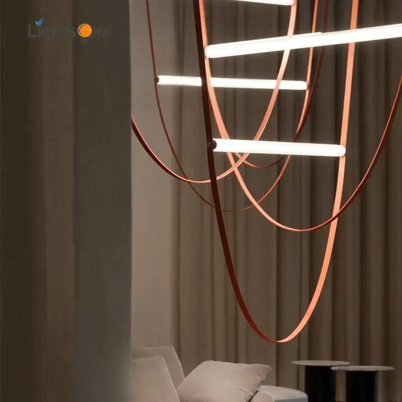 Modern copper-toned leather-wrapped decorbites glass tube pendant light with sleek curved design for living spaces