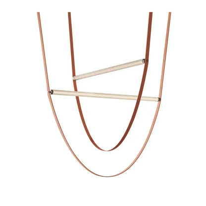 A minimalist copper-toned leather necklace with two wooden bars featured alongside decorbites glass tube pendant light