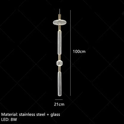 A modern 100cm decorbites glass tubes pendant lamp with clear glass tubes, brushed brass accents, and stainless steel frame